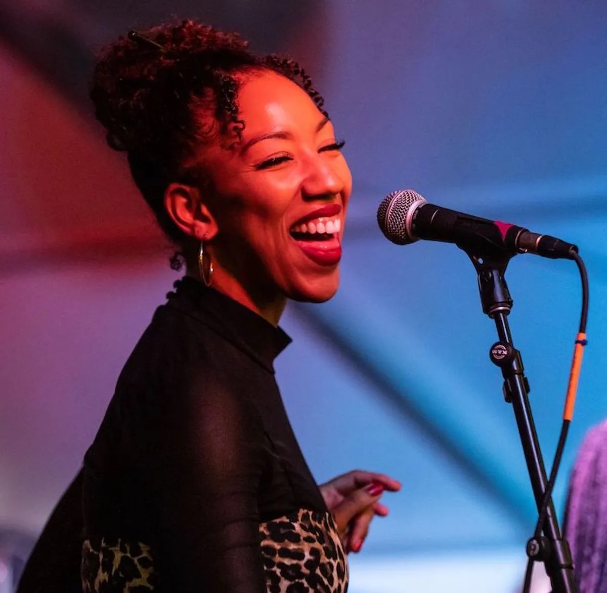 Vocalist singing into a microphone